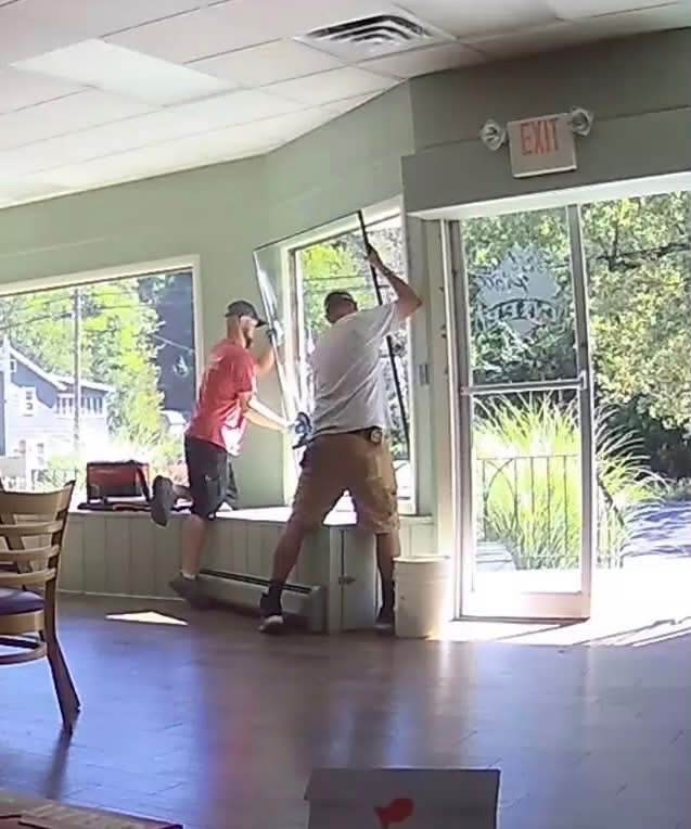 bedco volunteers installing new windows at first place cafe